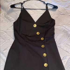 Black mid length dress with gold buttons